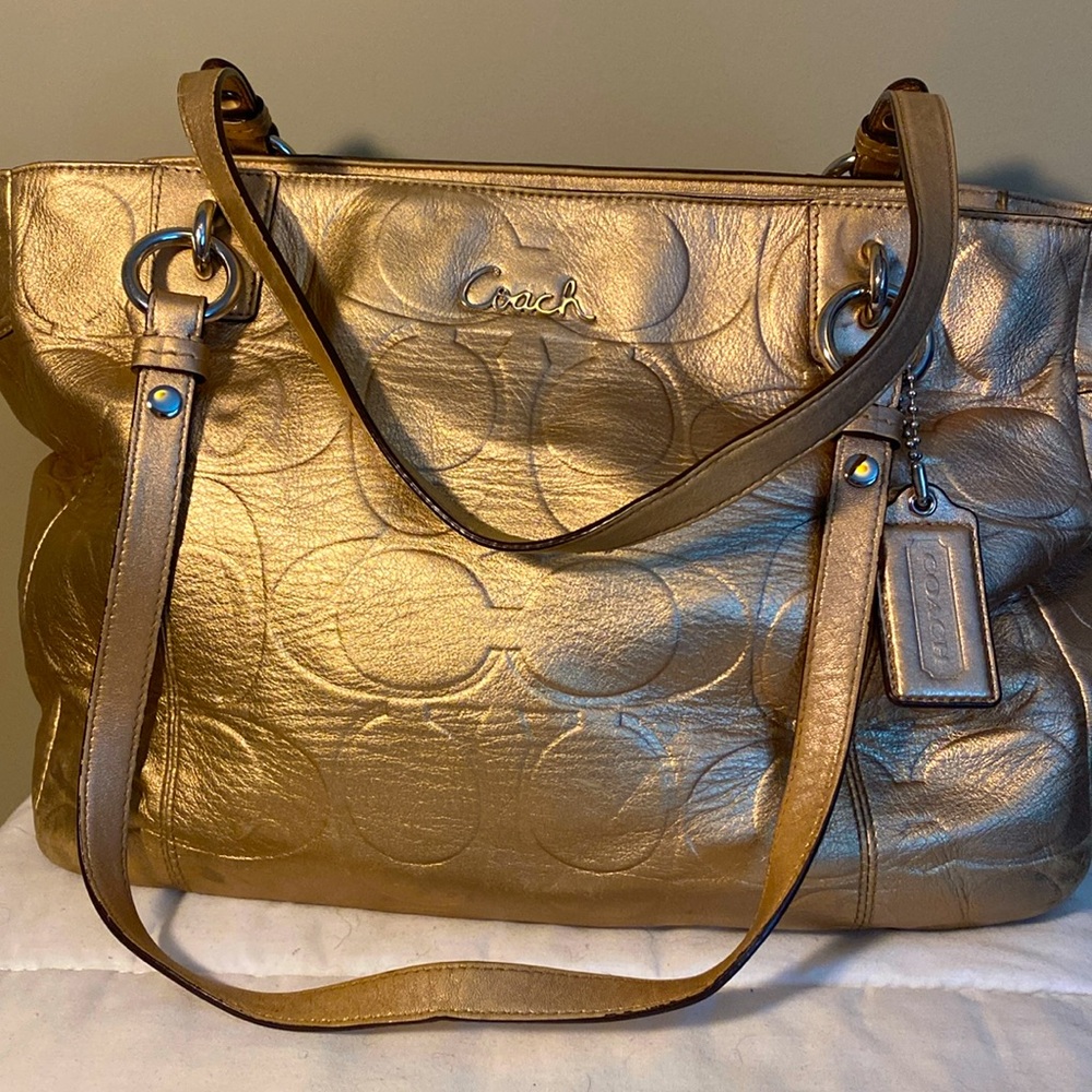 Coach gold leather. Very few spots in great shape.